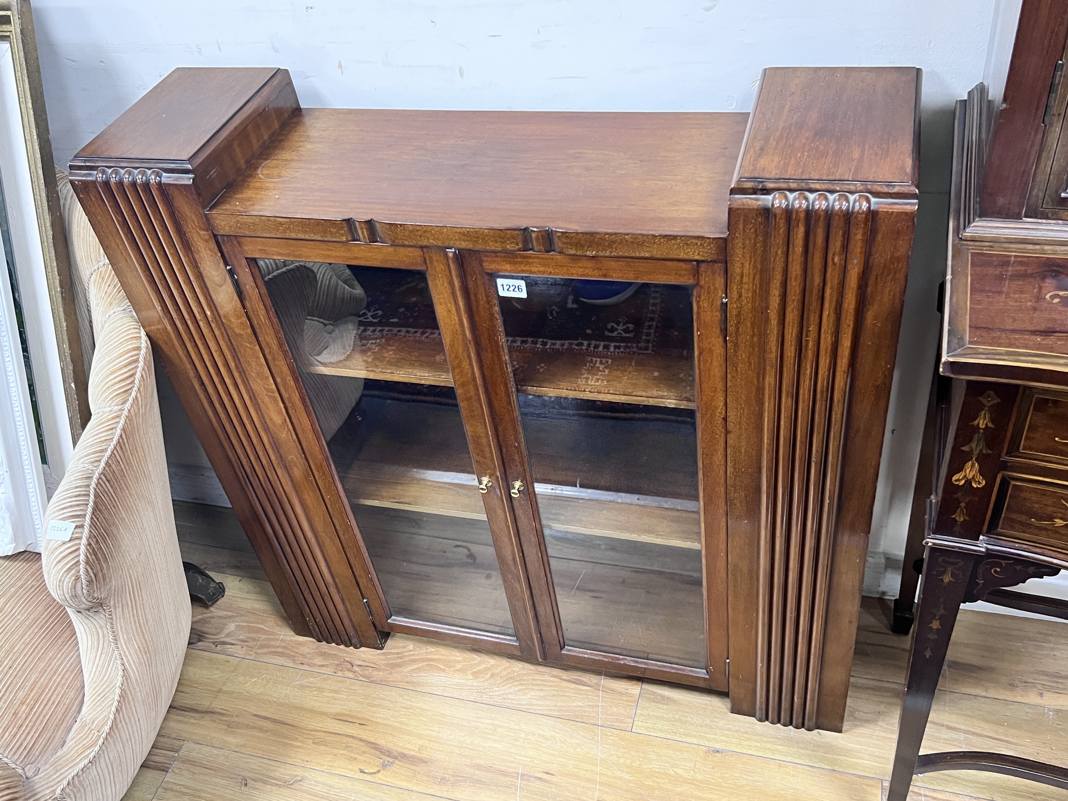 An Art Deco glazed walnut bookcase, width 90cm, depth 25cm, height 91cm